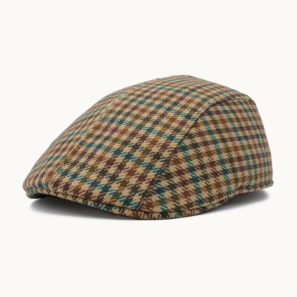 Gorra Equestrian de cashmere en tonos verde y tierra con patrón de cuadros Gorras Paula hecha en España vista frontal
