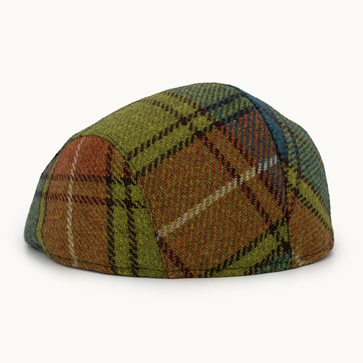 Gorra Heritage de lana verde y tierra con patrón de cuadros amplios Gorras Paula vista lateral